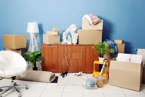 Same day removals team handling boxes in Shoreditch