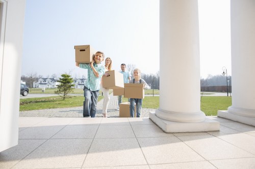 Furniture and packed boxes being arranged in a removals van
