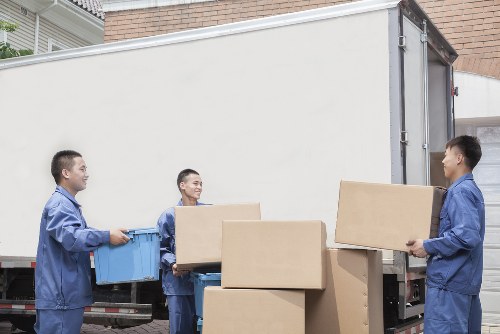 Professional movers carrying furniture in Shoreditch