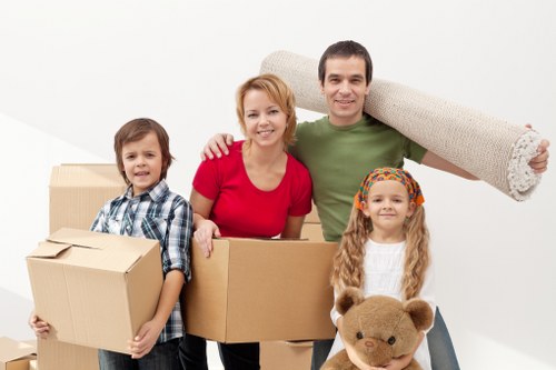 Professional movers loading furniture for same day removals