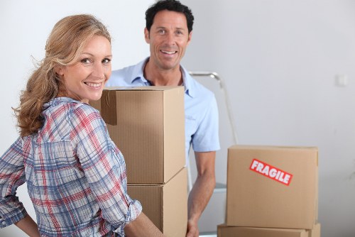 Movers handling boxes and furniture for a Shoreditch apartment relocation