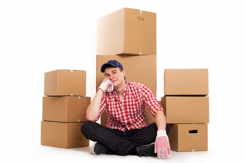 Professional movers carrying furniture during a Shoreditch flat move
