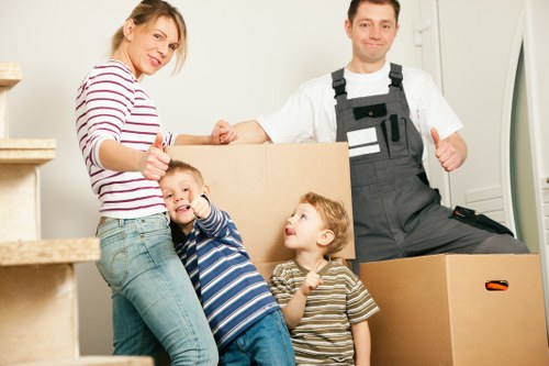 Specialist movers handling a piano move in Shoreditch with caution